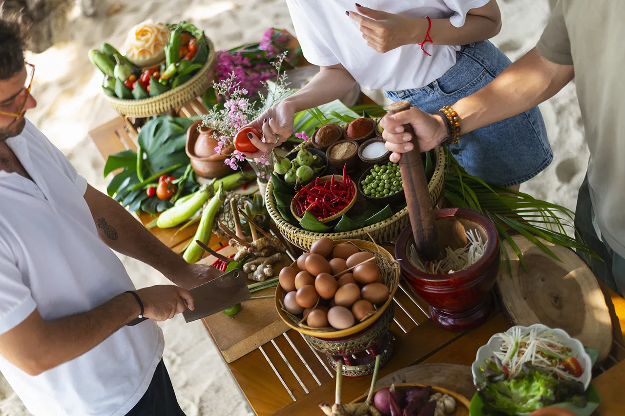 Thai cooking class at Explorar Koh Phangan with a variety of fresh Thai ingredients ready for guests to enjoy.