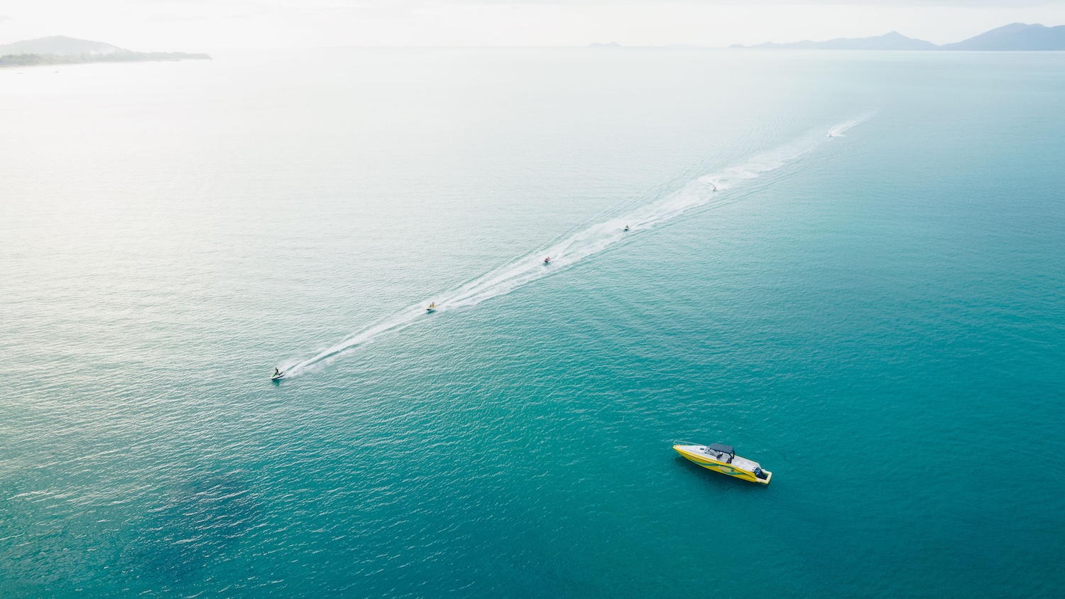 Jet ski adventure around Koh Samui with a rider exploring the turquoise waters and scenic coastline.